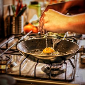 Close-up of hands preparing food