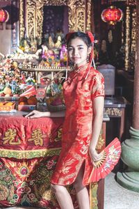 Portrait of smiling young woman in market