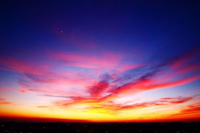 Low angle view of dramatic sky at sunset