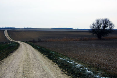 Empty country road along landscape