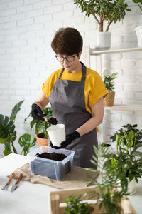 Cute girl gardening at home