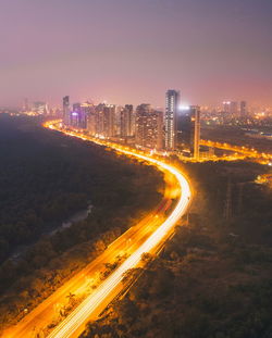 High angle view of light trails on road at night