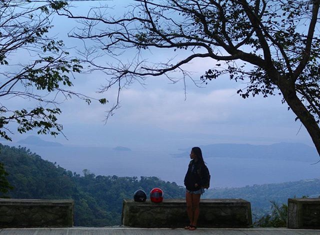 rear view, lifestyles, leisure activity, sky, water, tranquility, tranquil scene, standing, tree, scenics, looking at view, person, nature, sitting, men, lake, beauty in nature, full length