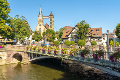 Germany, baden-wurttemberg, esslingen, st.-agnes-brucke with towers of stadtkirche st. dionys in background