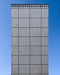 Low angle view of building against clear blue sky