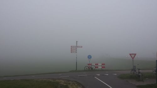 Road against sky during foggy weather