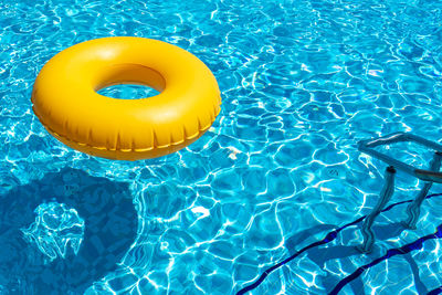 High angle view of inflatable ring in swimming pool