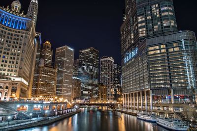 Illuminated buildings in city at night