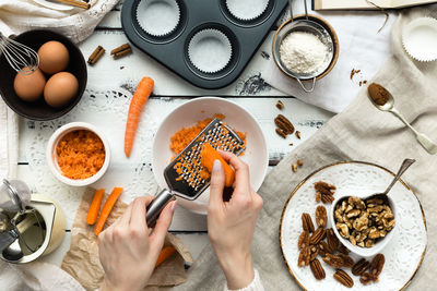 Directly above shot of person preparing food on table