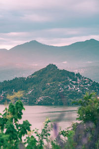 Scenic view of landscape and mountains against sky
