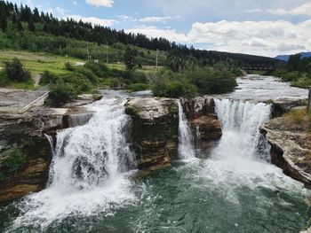 Scenic view of waterfall in forest