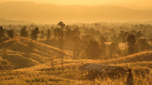 Scenic view of landscape against sky during sunset