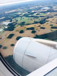 Aerial view of landscape seen through airplane window