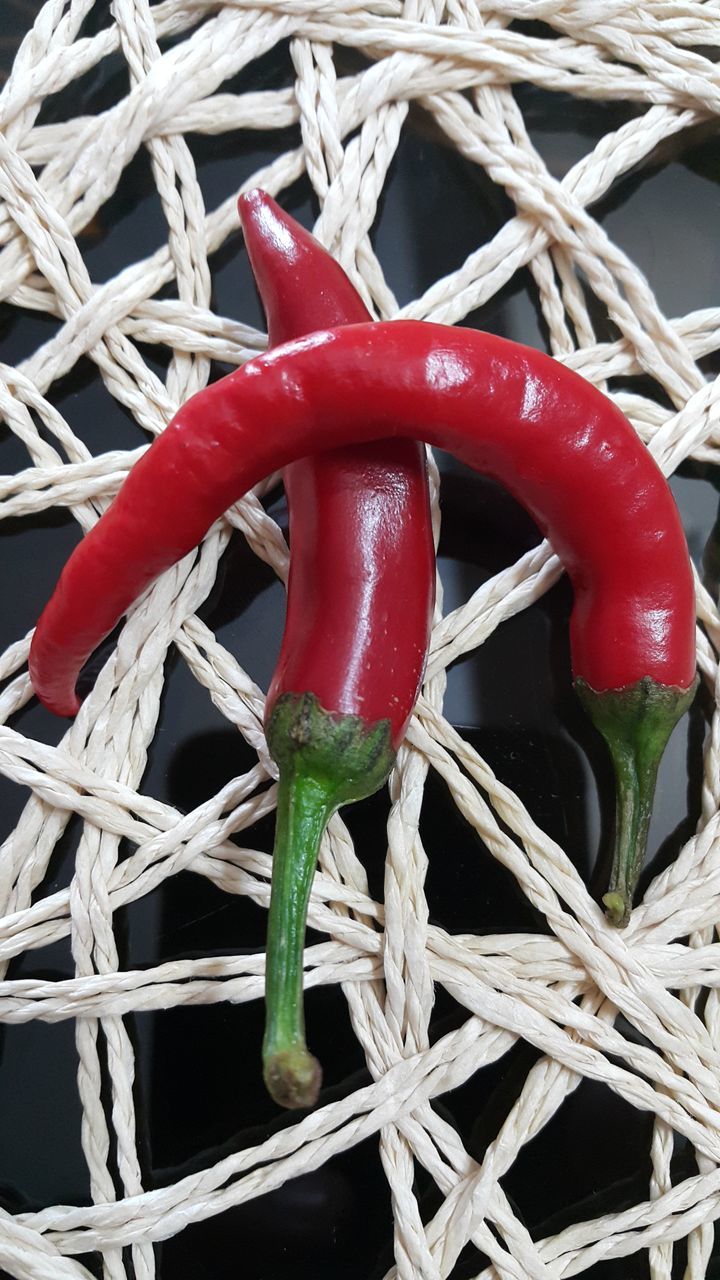 HIGH ANGLE VIEW OF TOMATOES IN WICKER BASKET