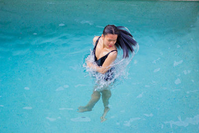 Beautiful asian young woman in the water