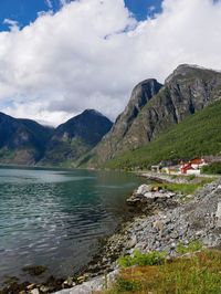 Scenic view of lake and mountains against sky