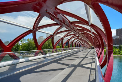 Metallic structure in city against sky