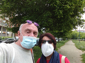 Portrait of smiling couple standing outdoors