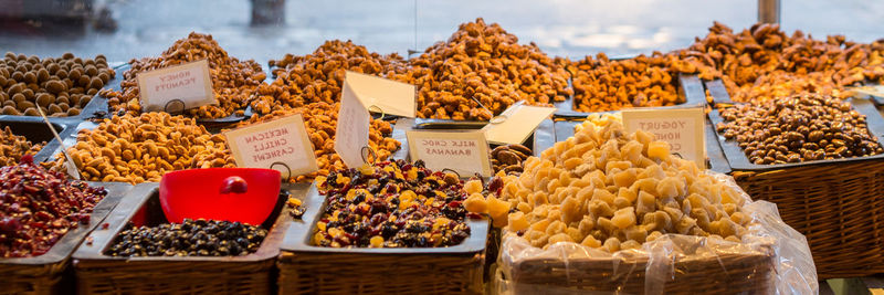 High angle view of sweet food in wicker containers in market for sale