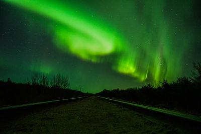 Scenic view of landscape against sky at night