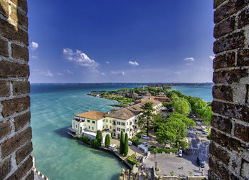 View of swimming pool by building against sky