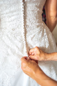 Cropped hand of person holding bridal cloth