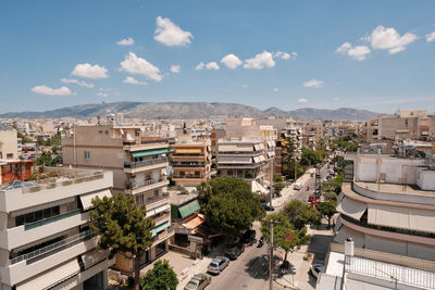 High angle view of buildings in city against sky