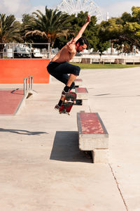 Skateboarder doing a trick in a skate park