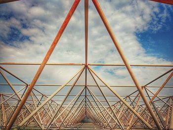 Low angle view of metallic structure against sky