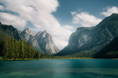 Scenic view of lake and mountains against sky