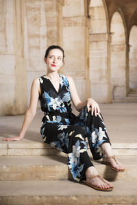 Portrait of woman sitting on steps