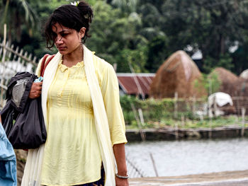 Young beautiful woman walking on street.