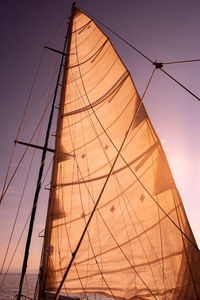 Low angle view of sailboat on sea against sky