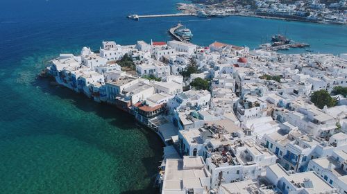 High angle view of sea amidst buildings in city