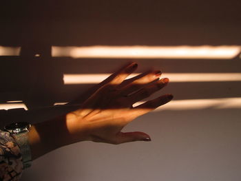 Close-up of woman hand on floor