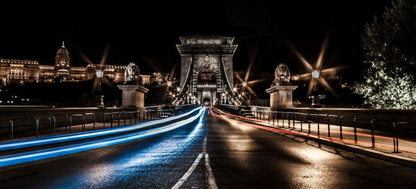 Light trails on suspension bridge at night