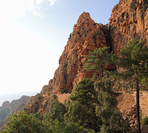 Rock formations on mountain against sky