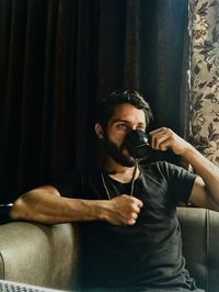 Young man having a great time with coffee 