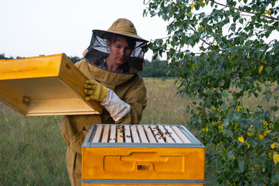 Rear view of man working at farm