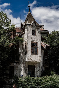 Low angle view of old building against sky