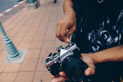 High angle view of man photographing camera