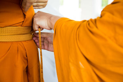 Close-up of friends wearing traditional clothes