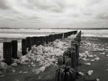 Scenic view of sea against cloudy sky