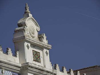 Low angle view of building against blue sky