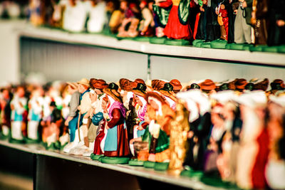 Close-up of figurines for sale in store