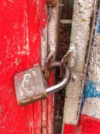 Close-up of rusty padlock on wall