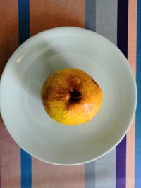 High angle view of fruits in plate on table