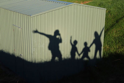 Shadow of people on built structure