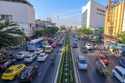 High angle view of traffic on road amidst buildings in city