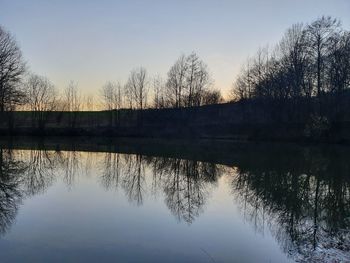 Scenic view of lake against sky during sunset